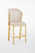 A cream upholstered bar stool with a gold metallic frame and a full backrest.