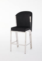A gray upholstered bar stool with a metal frame.