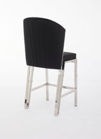 A gray upholstered bar stool with a metal frame.