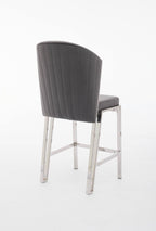A gray upholstered bar stool with a metal frame.