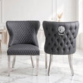 Grey faux leather Valentino lion knocker dining chairs with button-tufted back, silver lion ring and chrome legs