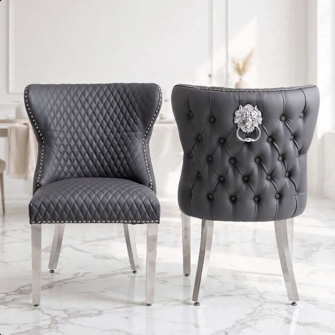 Grey faux leather Valentino lion knocker dining chairs with button-tufted back, silver lion ring and chrome legs