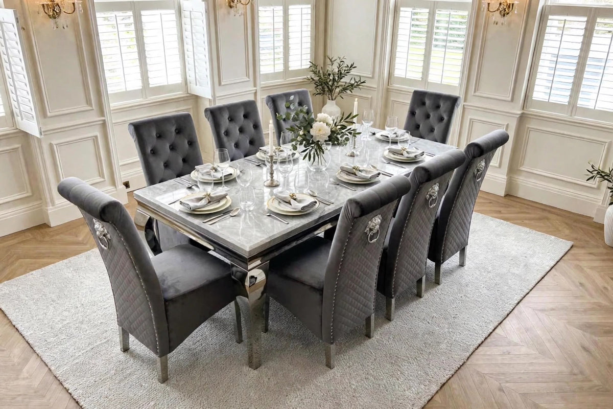 Light grey marble Louis dining table with eight dark grey velvet Sofia lion knocker chairs and chrome legs – luxury dining set UK