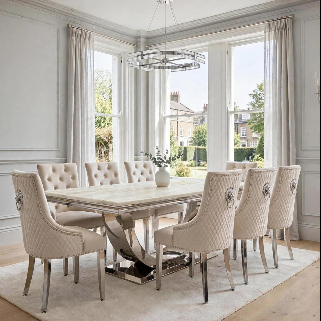 Close-up of mink velvet Majestic dining chair beside a cream marble London table