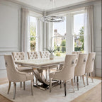 Close-up of mink velvet Majestic dining chair beside a cream marble London table