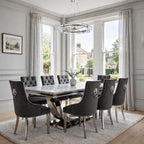 Close-up of dark grey velvet Majestic dining chair beside a light grey marble London table