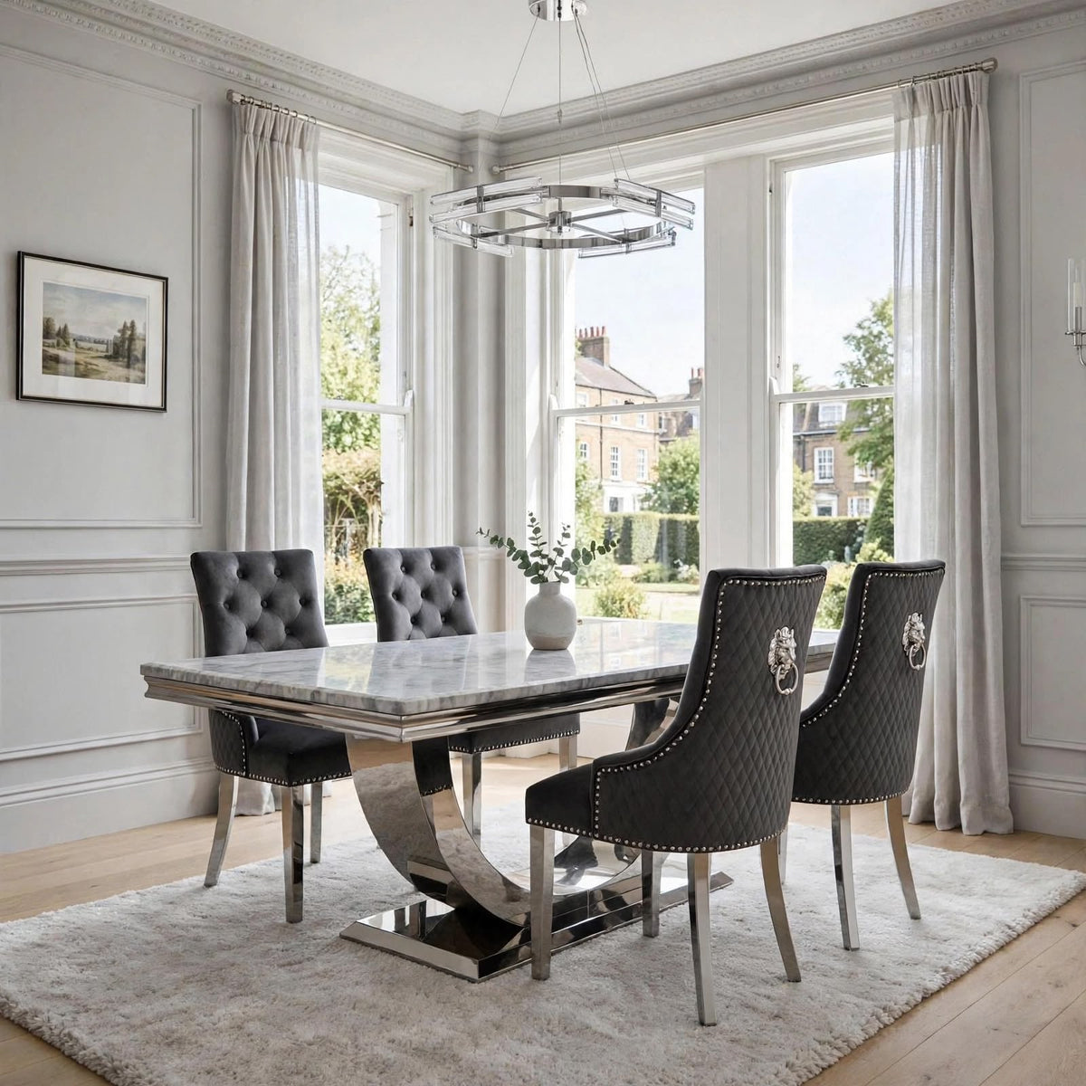 Light grey marble dining table with polished chrome London base and four dark grey velvet Majestic chairs