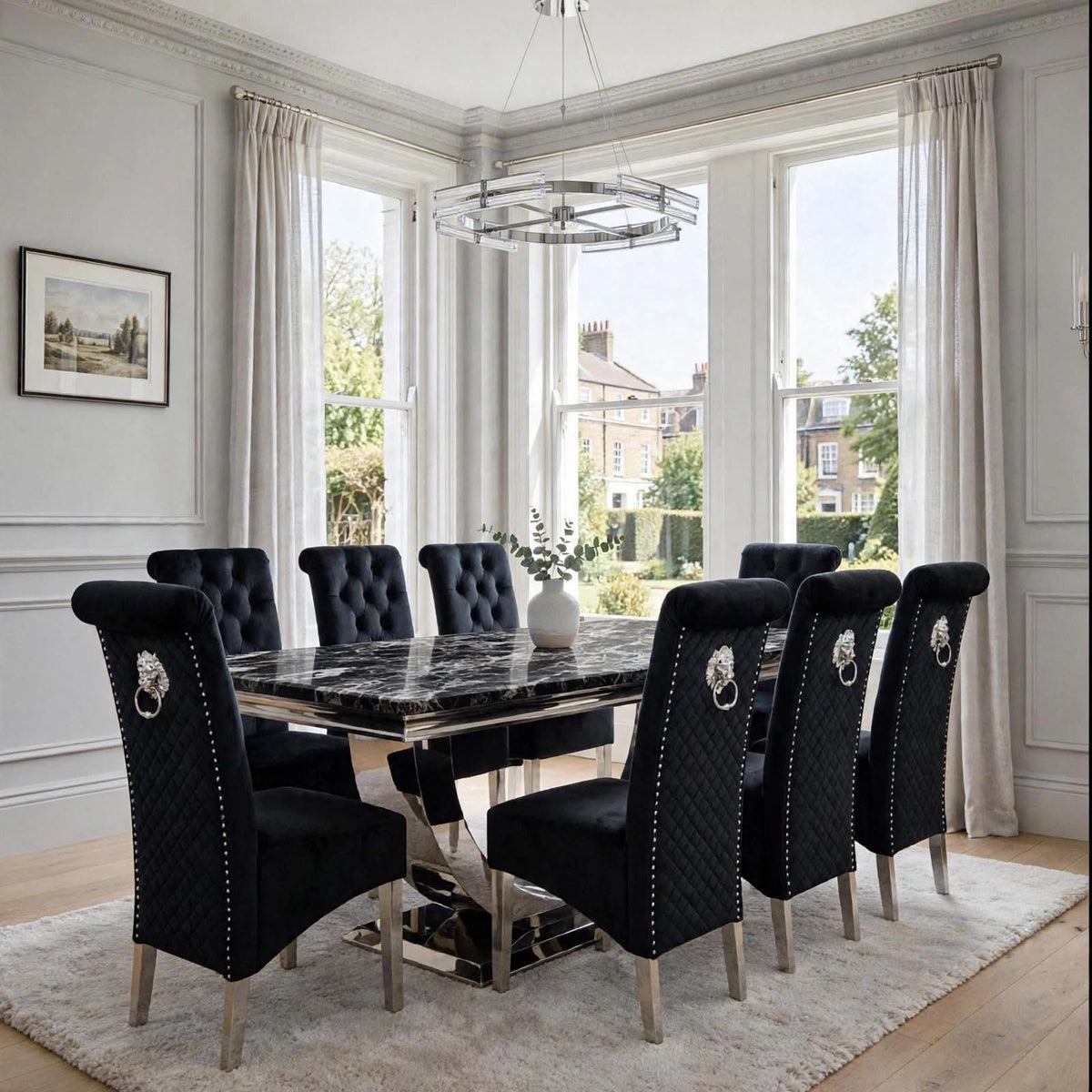 Close-up of black velvet Sofia dining chair beside a black marble London table