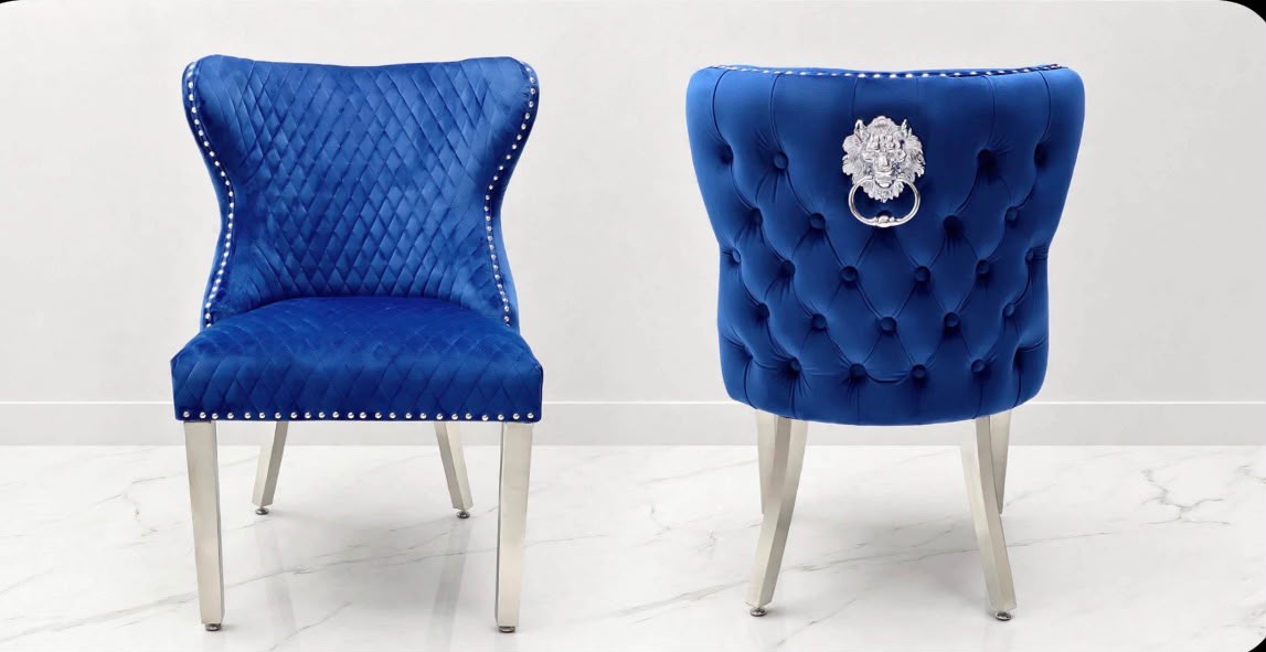 Navy blue velvet Valentino lion knocker dining chairs with button-tufted back, silver lion ring and chrome legs
