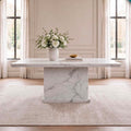 White marble dining table 1.5m with rectangular top and solid marble pedestal base in a luxury dining room